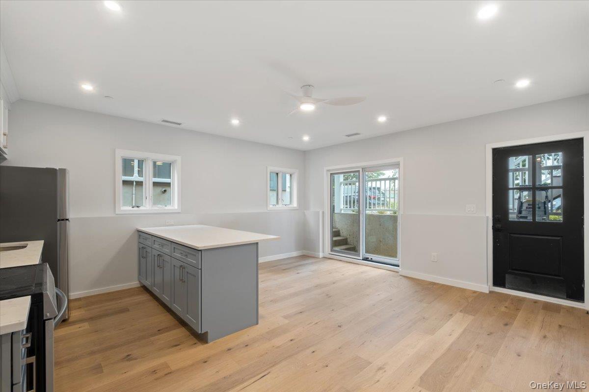 46 Hudson Street, Unit 1 Sleepy Hollow, NY 10591 - Photo 3 of 31 a view of an empty room with a window and wooden floor