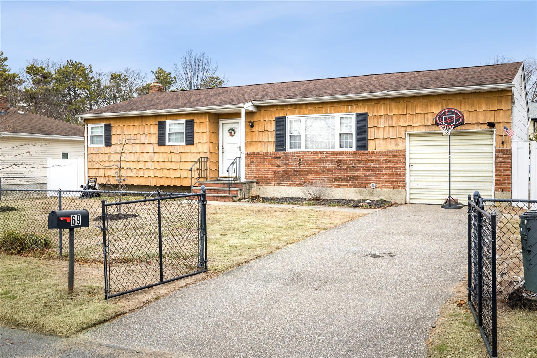 69 Walnut Road Amityville, NY 11701 - Photo 1 of 1 Single story home with a front lawn