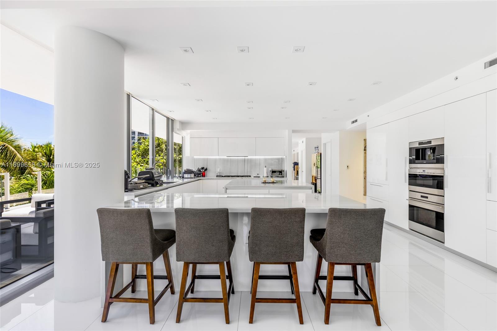 1 Collins Avenue, Unit 207 Miami Beach, FL 33139 - Photo 16 of 44 a dining room with furniture and window