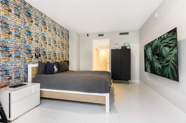 a bathroom with a sink toilet and mirror