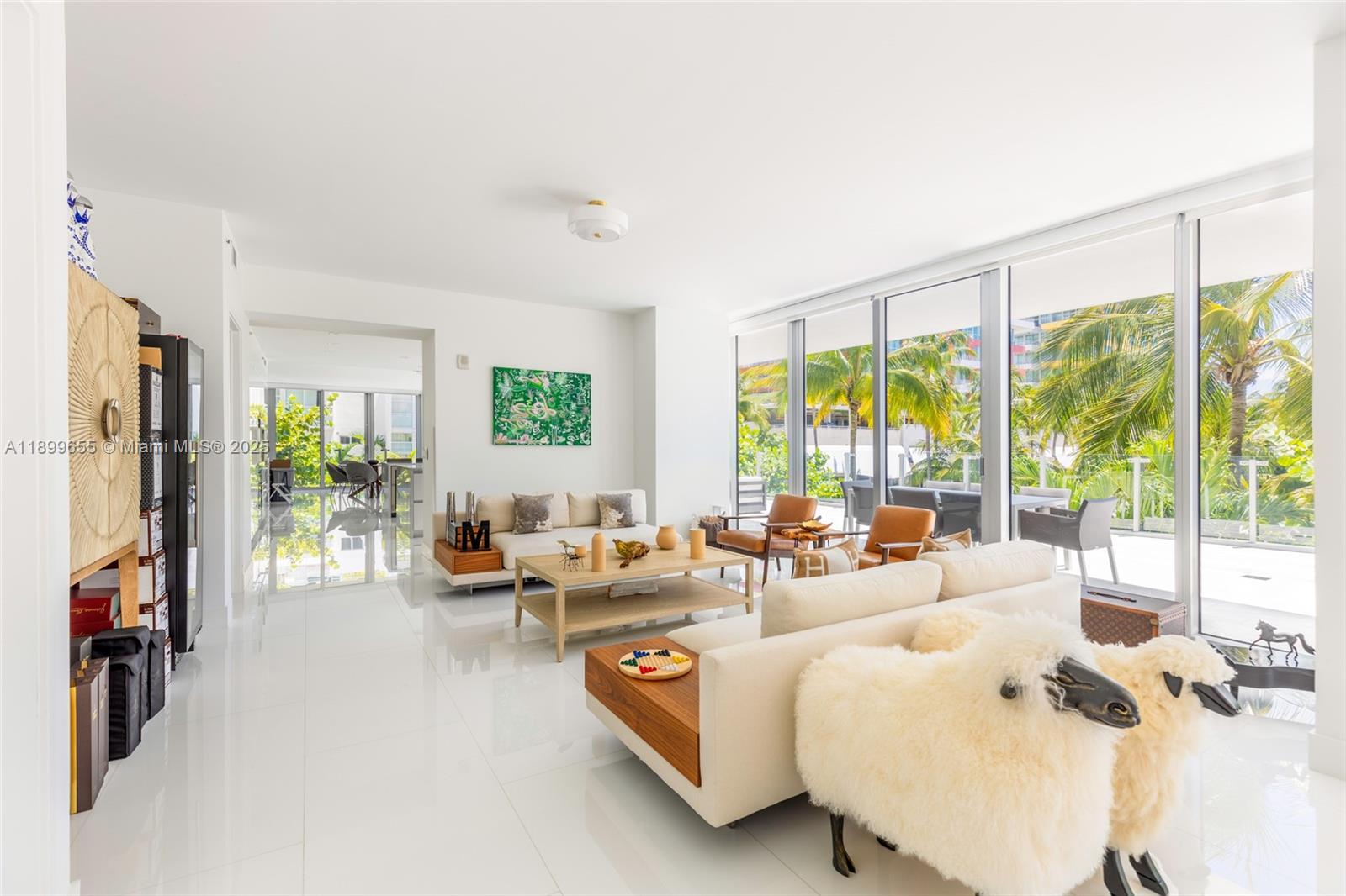 1 Collins Avenue, Unit 207 Miami Beach, FL 33139 - Photo 9 of 44 a living room with furniture and a large window