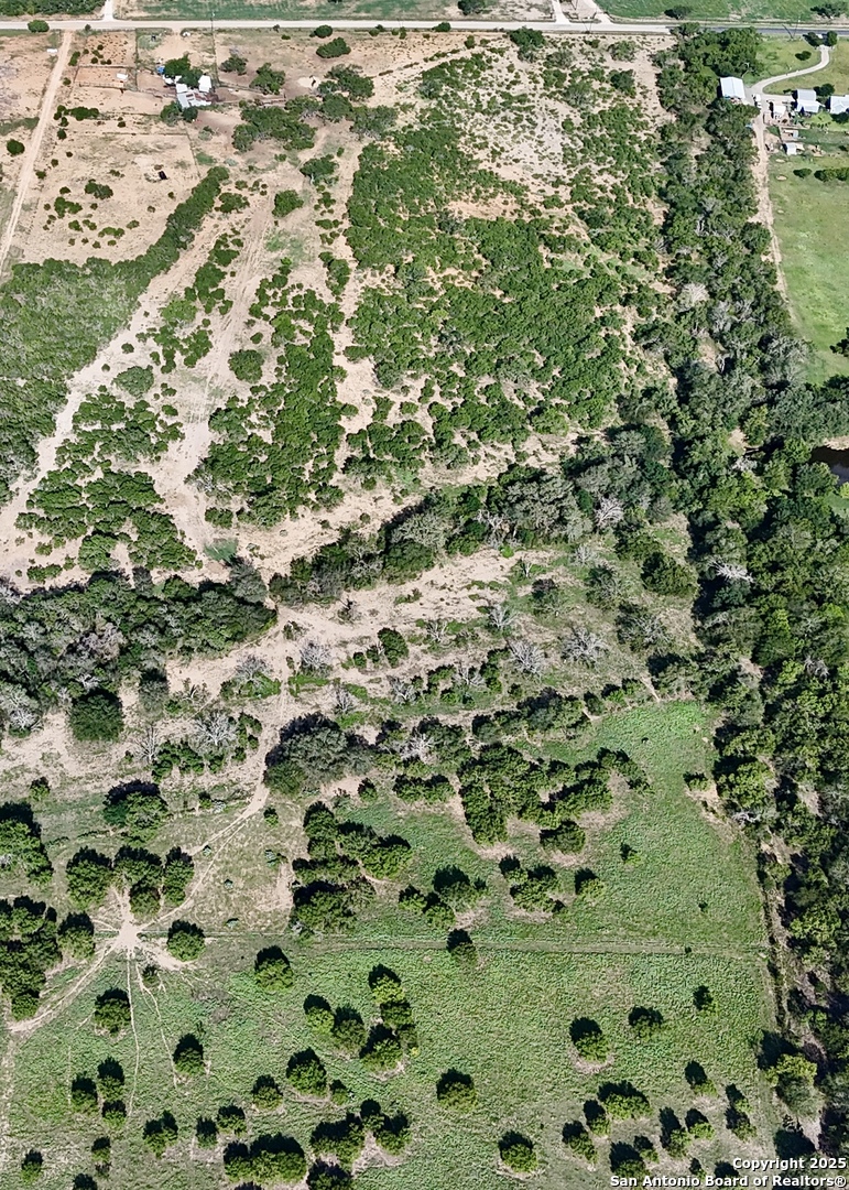 3285 Pittman Road St. Hedwig, TX 78152 - Photo 2 of 15 an aerial view of a house with a yard