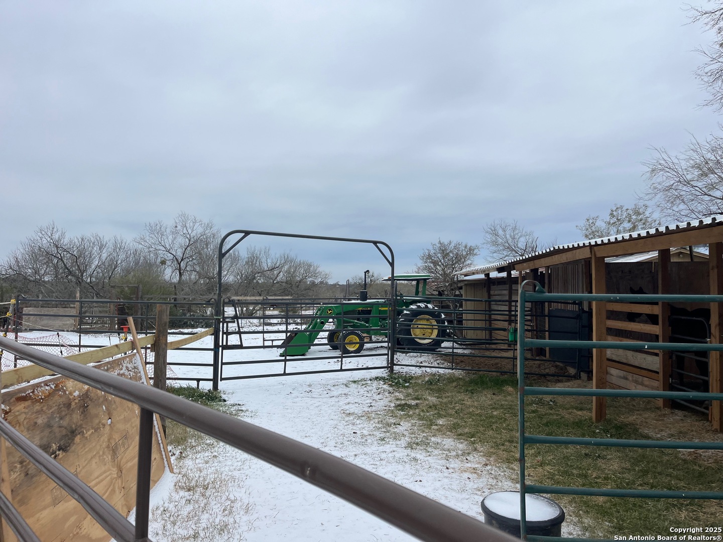 3285 Pittman Road St. Hedwig, TX 78152 - Photo 7 of 15 a view of a balcony with a floor to ceiling window and wooden fence