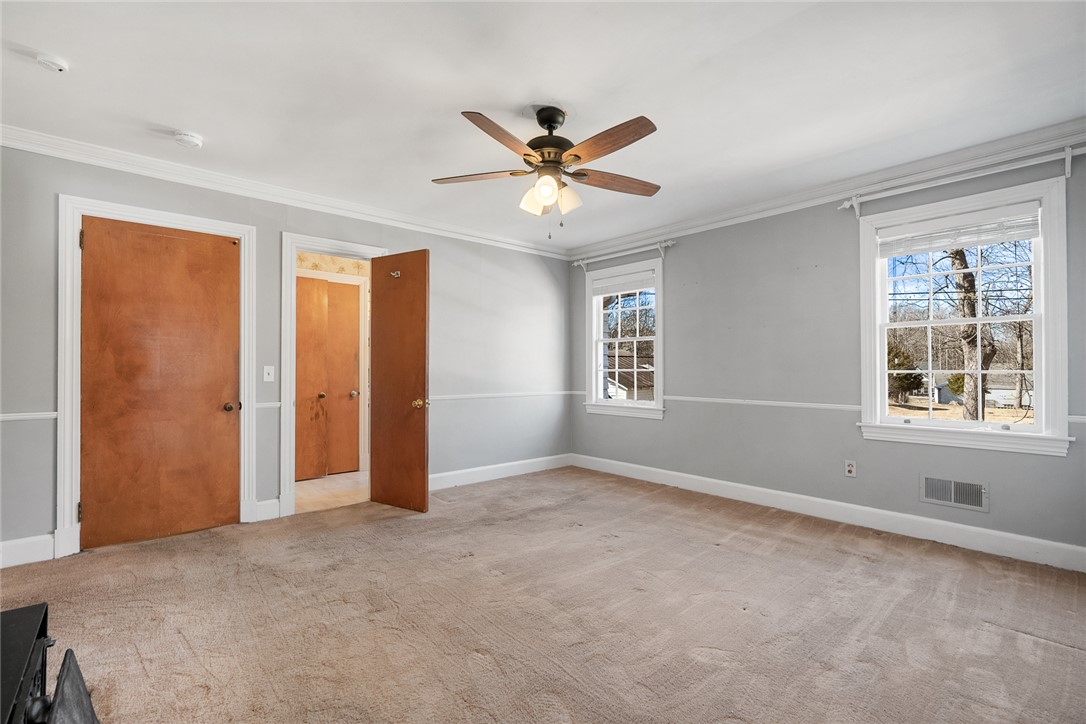 310 River Street Belton, SC 29627 - Photo 23 of 50 Primary Bedroom - windows shown view the back yard