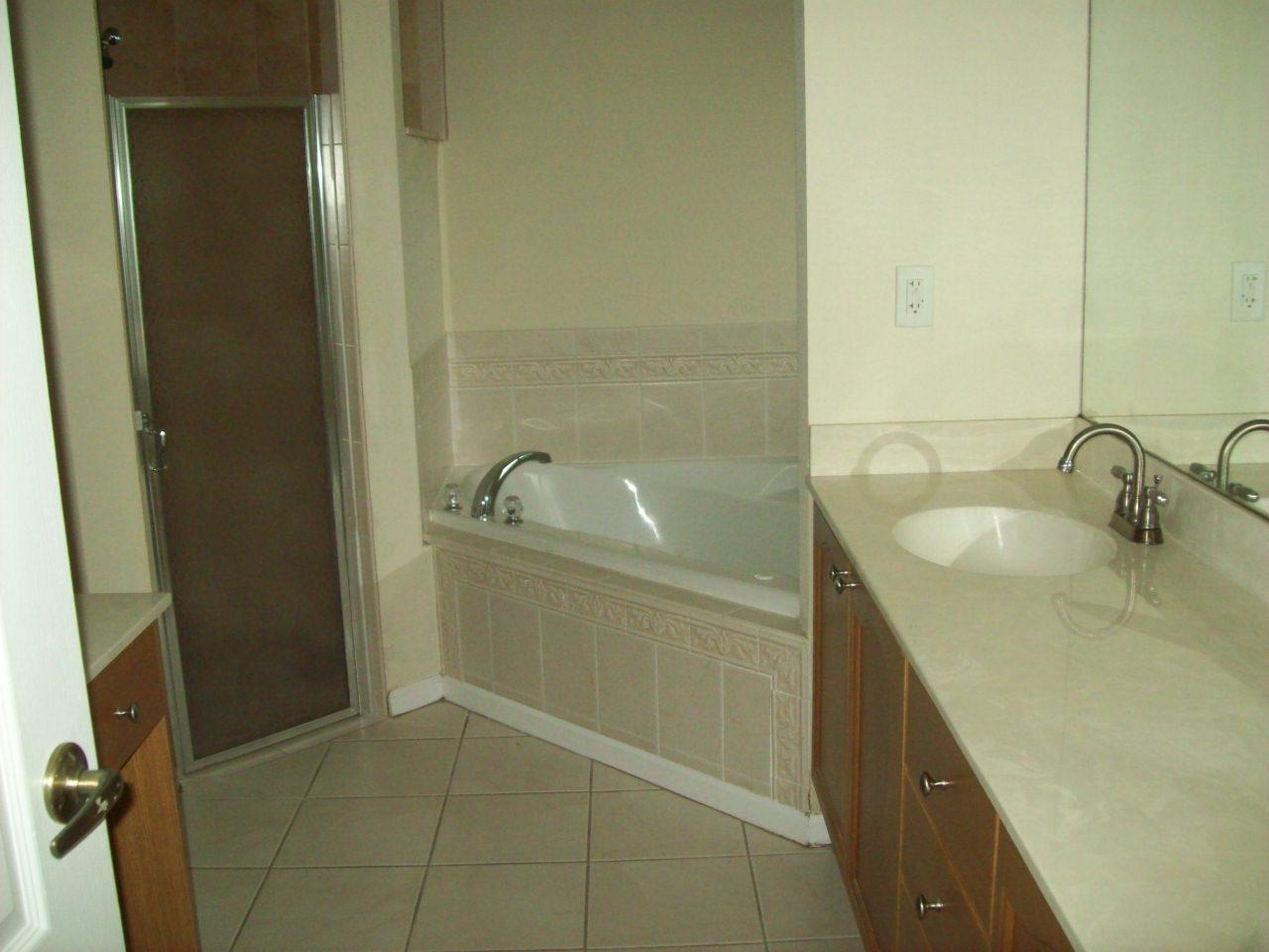 4342 Southwest Paley Road Port St. Lucie, FL 34953 - Photo 9 of 14 MASTER BATHROOM