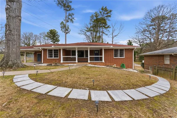 front view of a house with a yard
