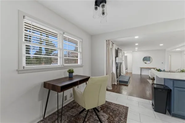 a dining room with furniture and window