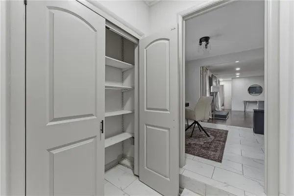 a bathroom with a glass door shower