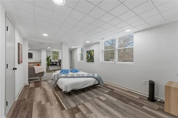 a bathroom with a toilet a sink and a shower curtain