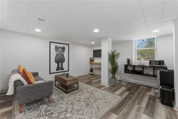 a living room with furniture and a rug