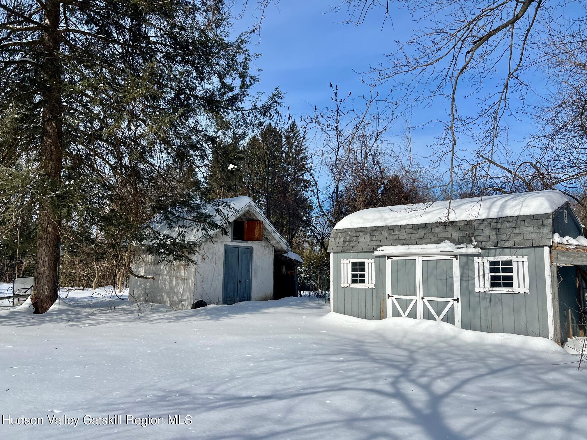 156 Co Rte 10 Germantown, NY 12526 - Photo 8 of 8 a front view of a house with a yard and garage