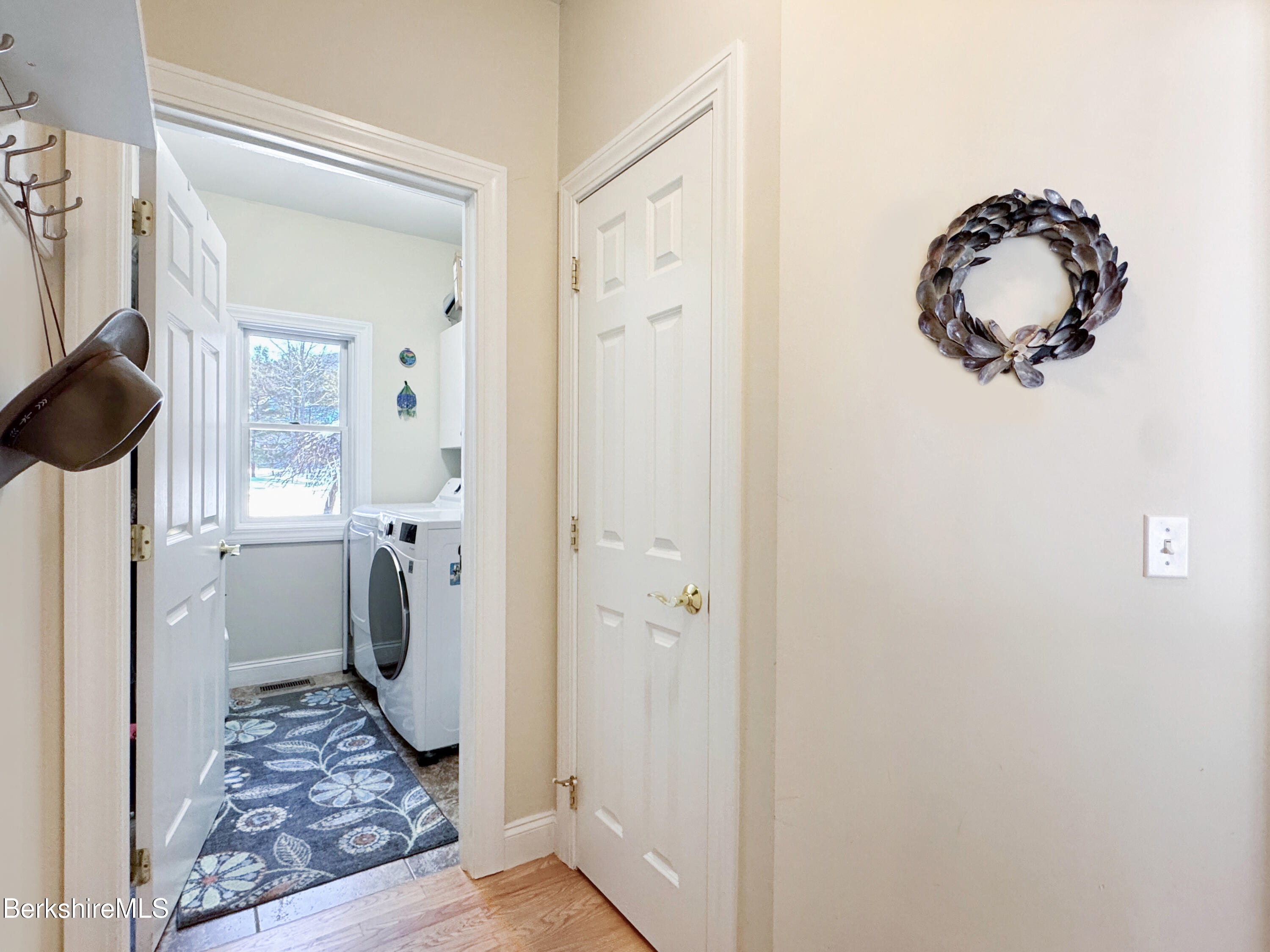 5 Eastbrook Lane Pittsfield, MA 01201 - Photo 23 of 43 a view of a hallway and a dining area with a bathroom
