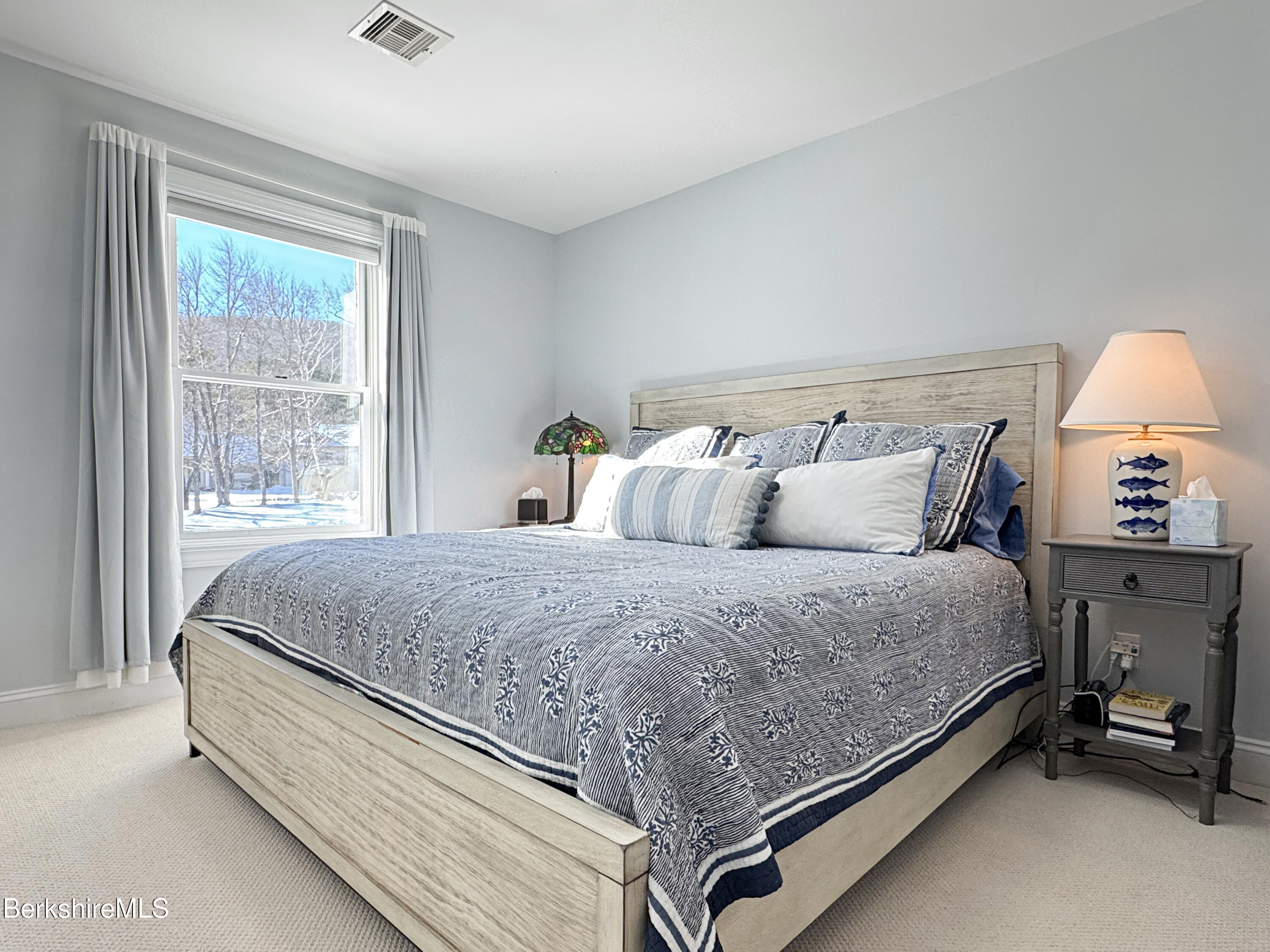 5 Eastbrook Lane Pittsfield, MA 01201 - Photo 32 of 43 a bed sitting in a bedroom next to a window