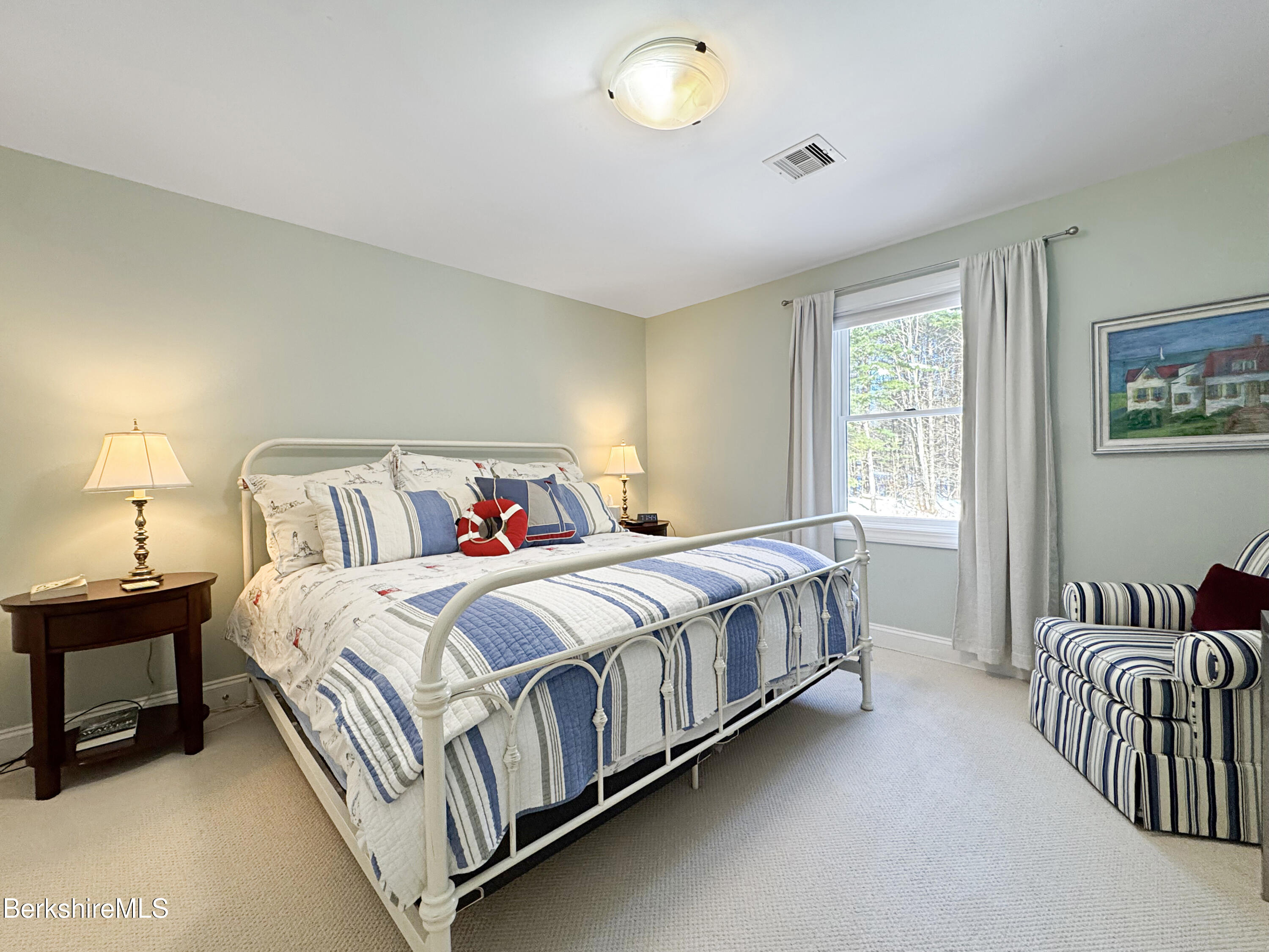 5 Eastbrook Lane Pittsfield, MA 01201 - Photo 37 of 43 a bedroom with a bed and a chandelier