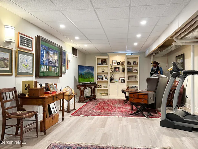 a view of a livingroom with furniture and a flat screen tv
