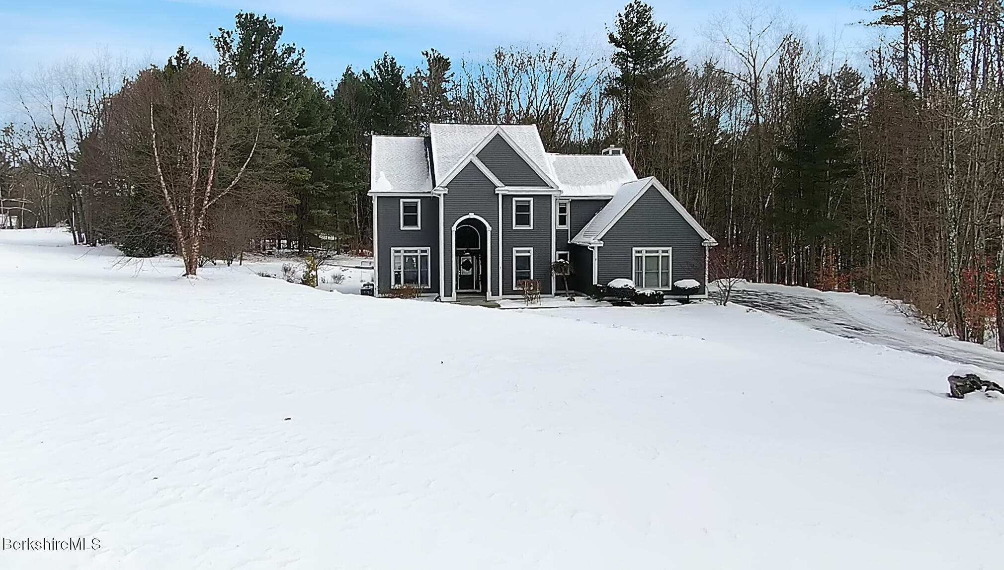 5 Eastbrook Lane Pittsfield, MA 01201 - Photo 42 of 43 a view of a house with a yard covered in snow