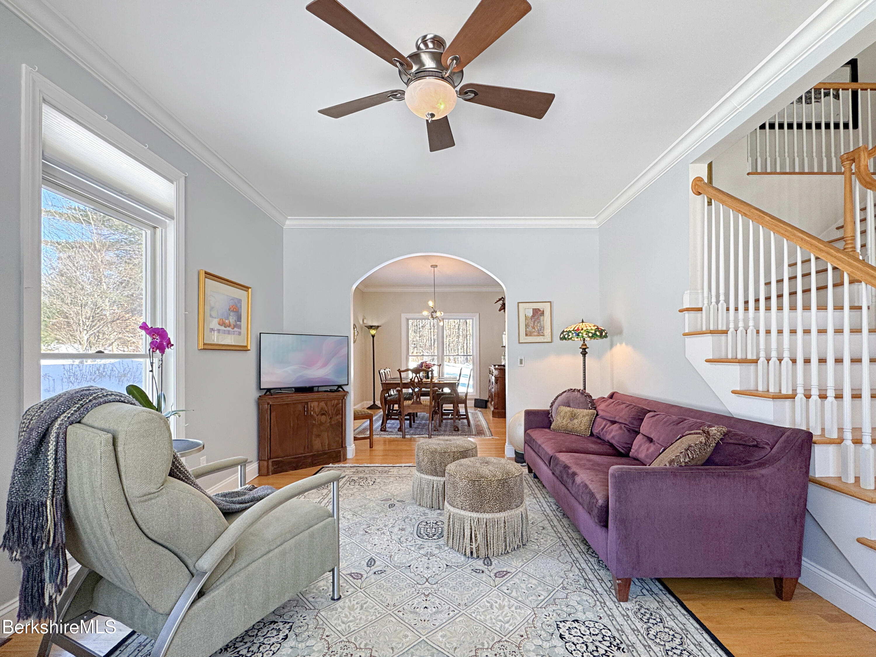 5 Eastbrook Lane Pittsfield, MA 01201 - Photo 6 of 43 a living room with furniture a rug and a chandelier