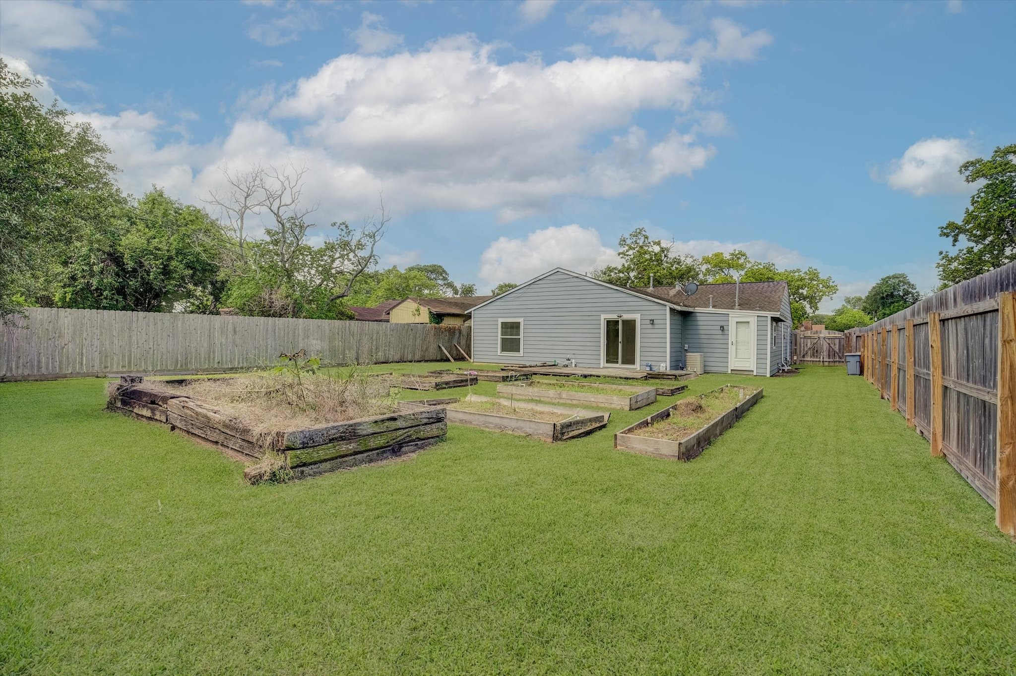 413 Farrer Street Angleton, TX 77515 - Photo 40 of 43 a view of a house with pool and a yard