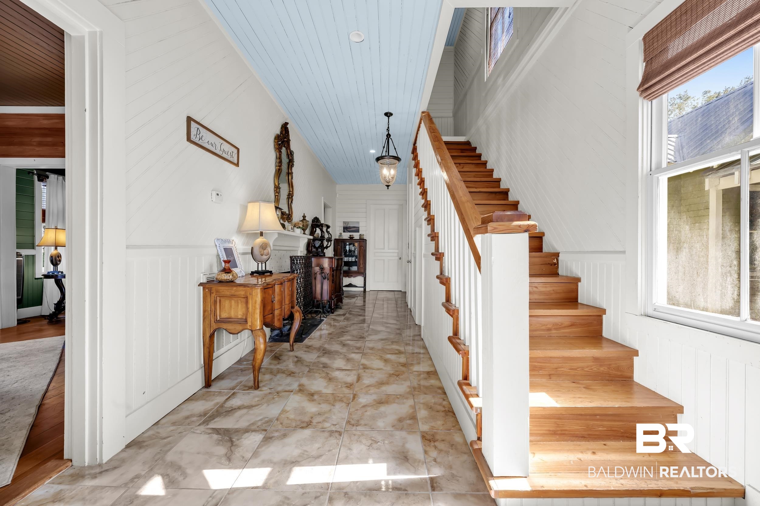 13232 Mary Ann Bch Road Fairhope, AL 36532 - Photo 8 of 79 Stairway with wooden walls, wainscoting, wooden ceiling, and a decorative wall