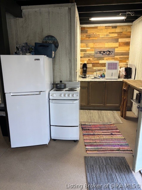 6024 Little Patoka Road Taswell, IN 47175 - Photo 10 of 26 View of refrigerator, range/oven and dehumidifier, which will remain with home