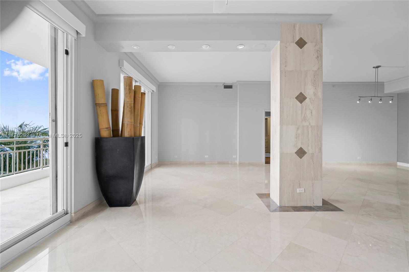 888 Brickell Key Drive, Unit 408 Miami, FL 33131 - Photo 13 of 55 a view of a bathroom with a tub and shower