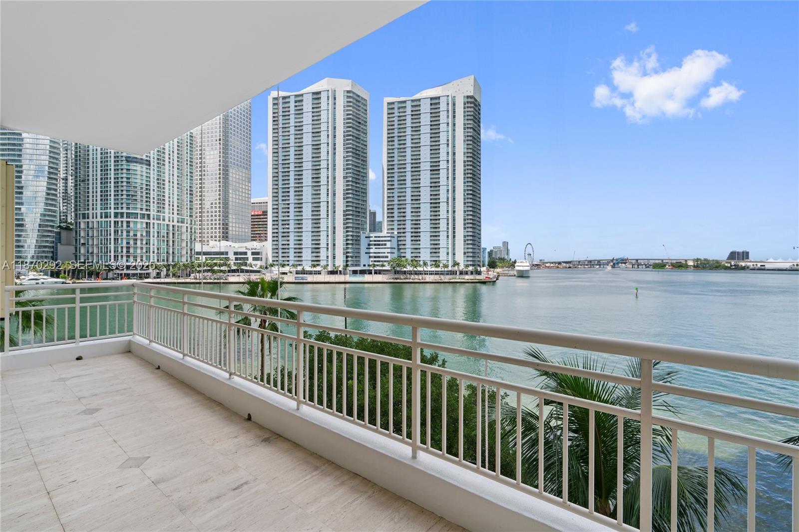 888 Brickell Key Drive, Unit 408 Miami, FL 33131 - Photo 2 of 55 a balcony with view of lake and city view
