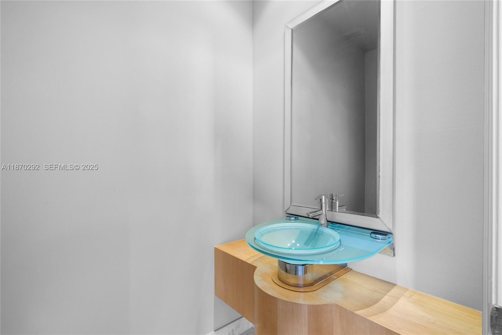 888 Brickell Key Drive, Unit 408 Miami, FL 33131 - Photo 21 of 55 a bathroom with a sink and a mirror