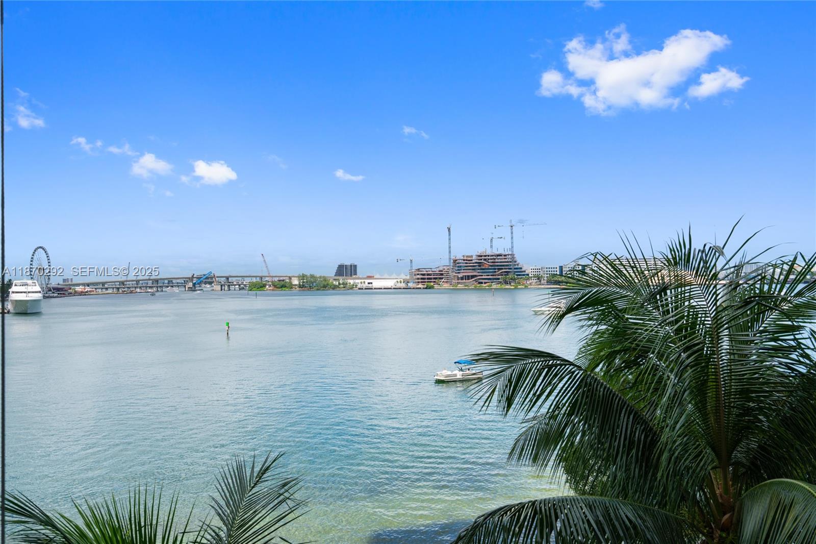 888 Brickell Key Drive, Unit 408 Miami, FL 33131 - Photo 51 of 55 a view of a lake with palm trees