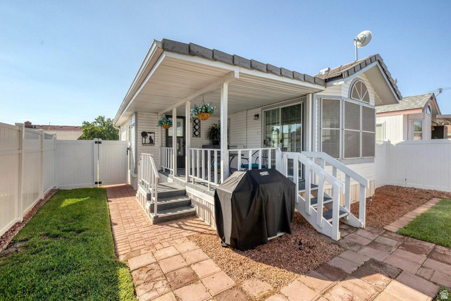 2990 East Riverside Drive, Unit 173 St. George, UT 84790 - Photo 3 of 38 Exterior featuring a covered porch, white railing, and steps