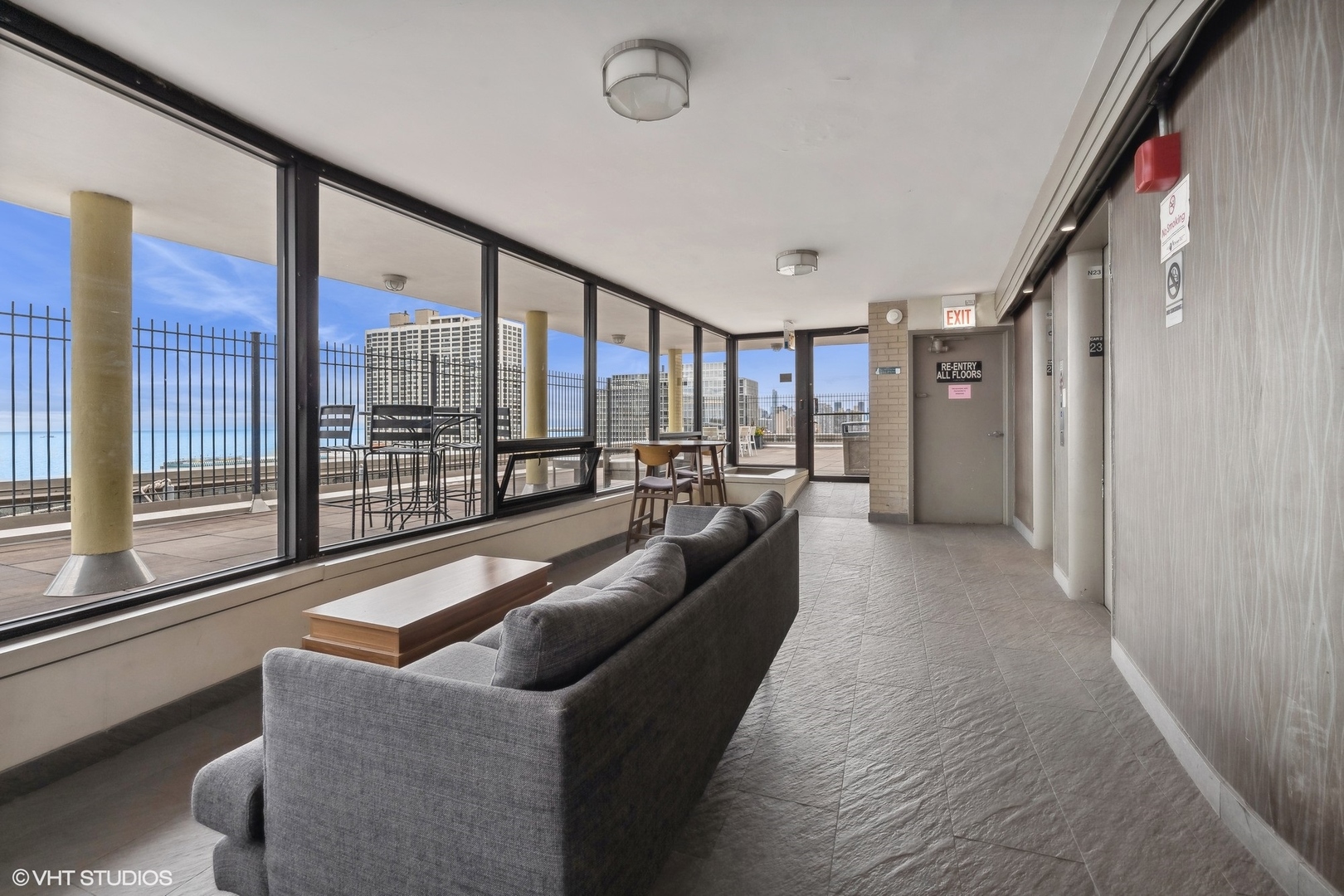2930 North Sheridan Road, Unit 301 Chicago, IL 60657 - Photo 14 of 20 a living room with furniture and a floor to ceiling window