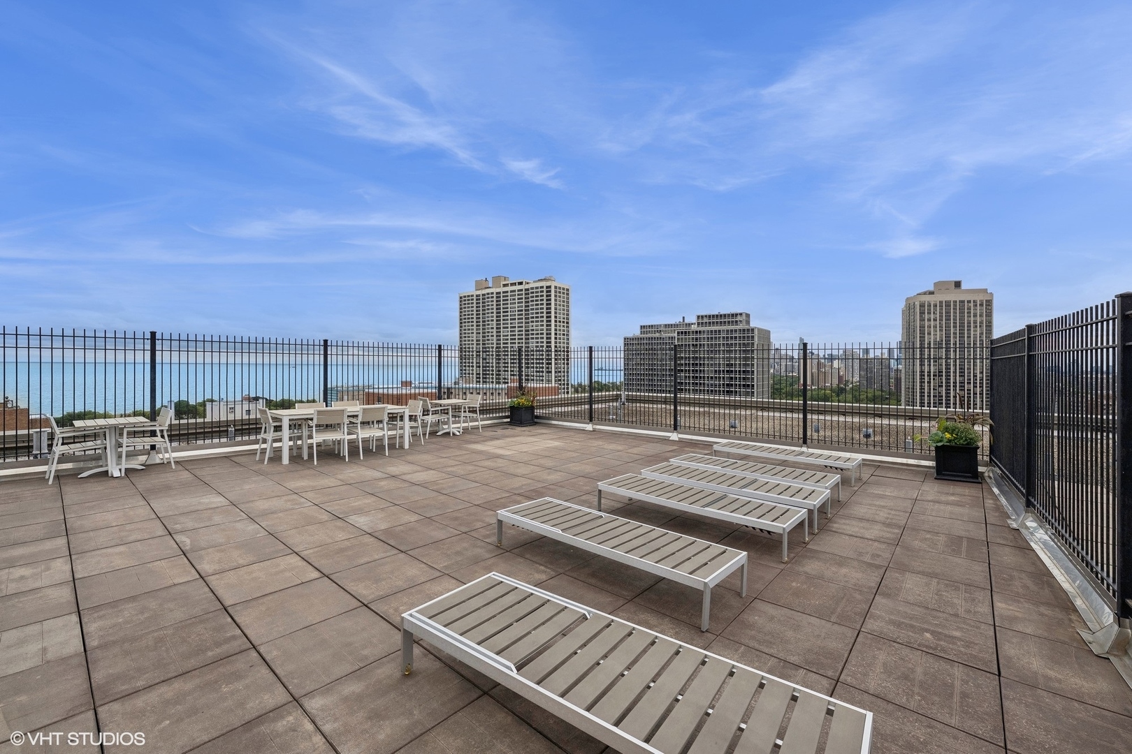 2930 North Sheridan Road, Unit 301 Chicago, IL 60657 - Photo 15 of 20 a view of a terrace with a bench