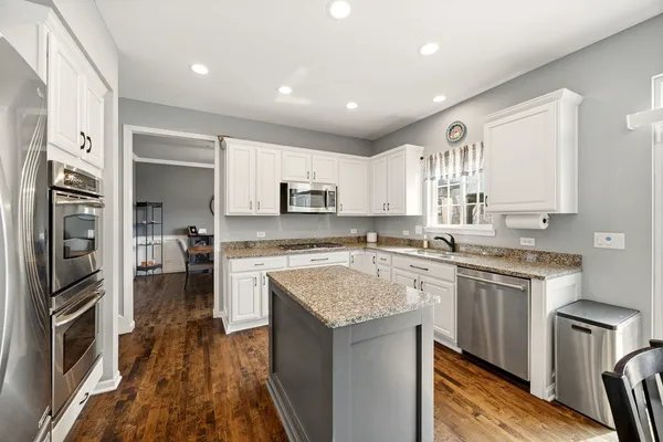 a kitchen with a sink stove and refrigerator