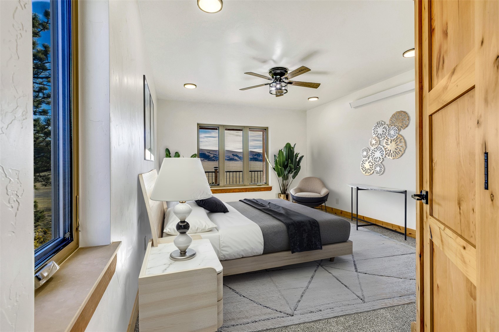 3415 Redhill Road Fairplay, CO 80440 - Photo 45 of 50 a bedroom with a bed and a chandelier