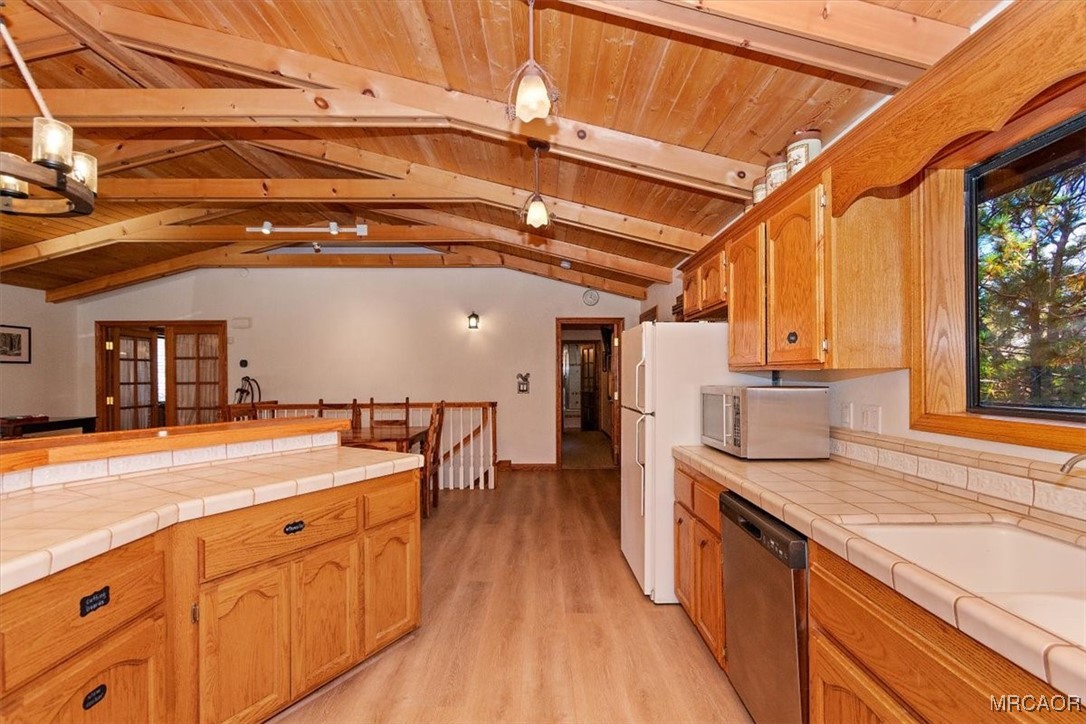 1584 Wolf Road Big Bear City, CA 92314 - Photo 14 of 33 a open kitchen with stainless steel appliances granite countertop a sink and cabinets