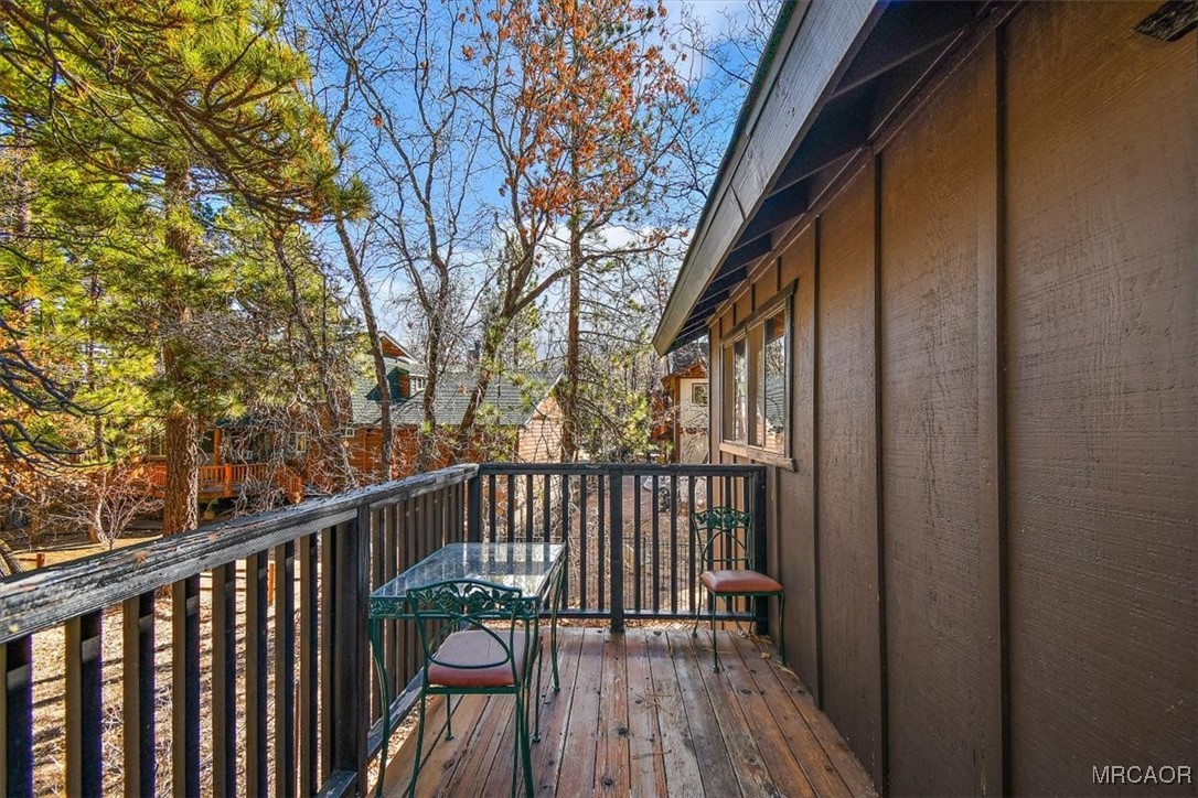 1584 Wolf Road Big Bear City, CA 92314 - Photo 26 of 33 a view of balcony with wooden floor and fence