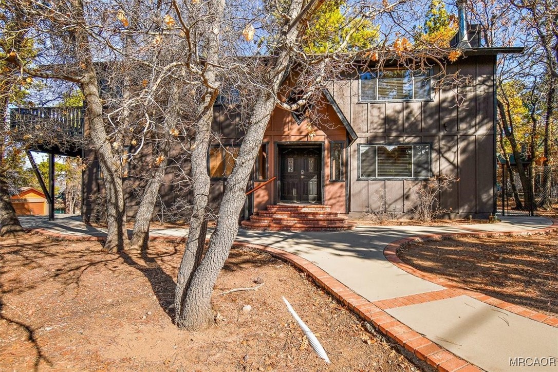 1584 Wolf Road Big Bear City, CA 92314 - Photo 32 of 33 a view of a house with a yard
