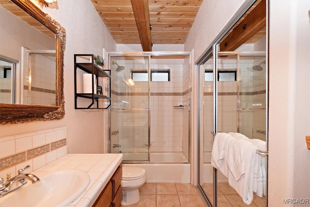 1584 Wolf Road Big Bear City, CA 92314 - Photo 5 of 33 a bathroom with a sink toilet and shower