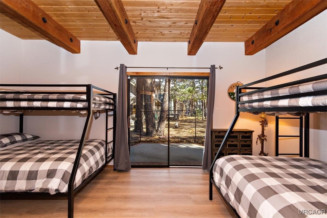 1584 Wolf Road Big Bear City, CA 92314 - Photo 6 of 33 a bedroom with a bed and a window