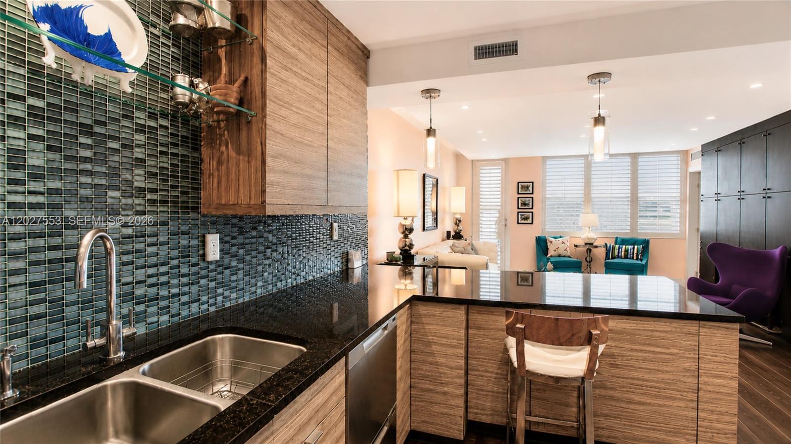 100 Lincoln Road, Unit 533 Miami Beach, FL 33139 - Photo 7 of 26 a kitchen with a sink and a refrigerator