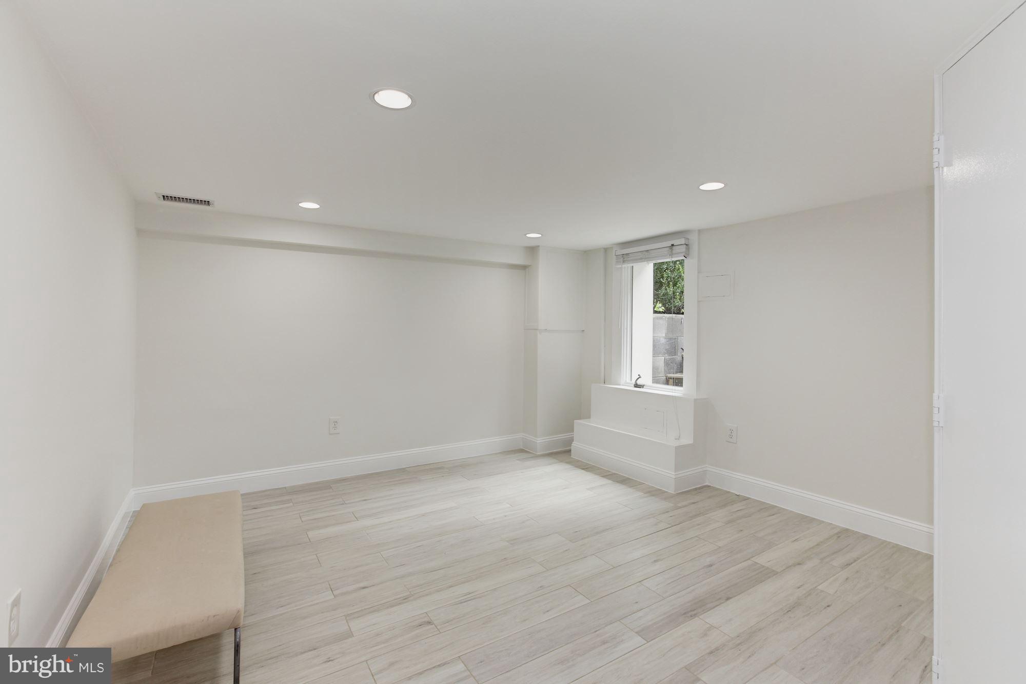 3523 S Street Northwest Washington, DC 20007 - Photo 11 of 15 a view of empty room with wooden floor and fan