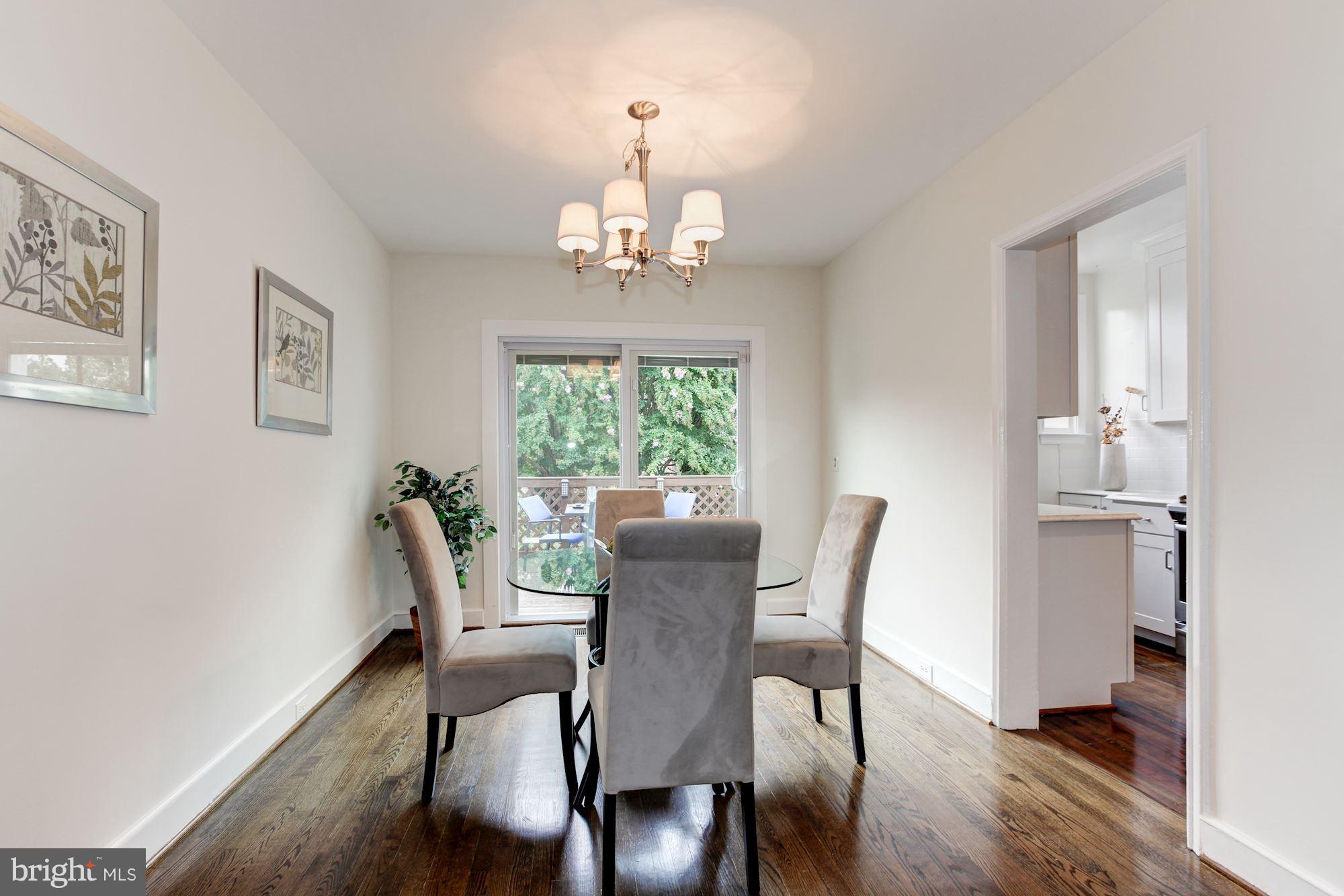 3523 S Street Northwest Washington, DC 20007 - Photo 3 of 15 a view of a dining room with furniture a chandelier and wooden floor