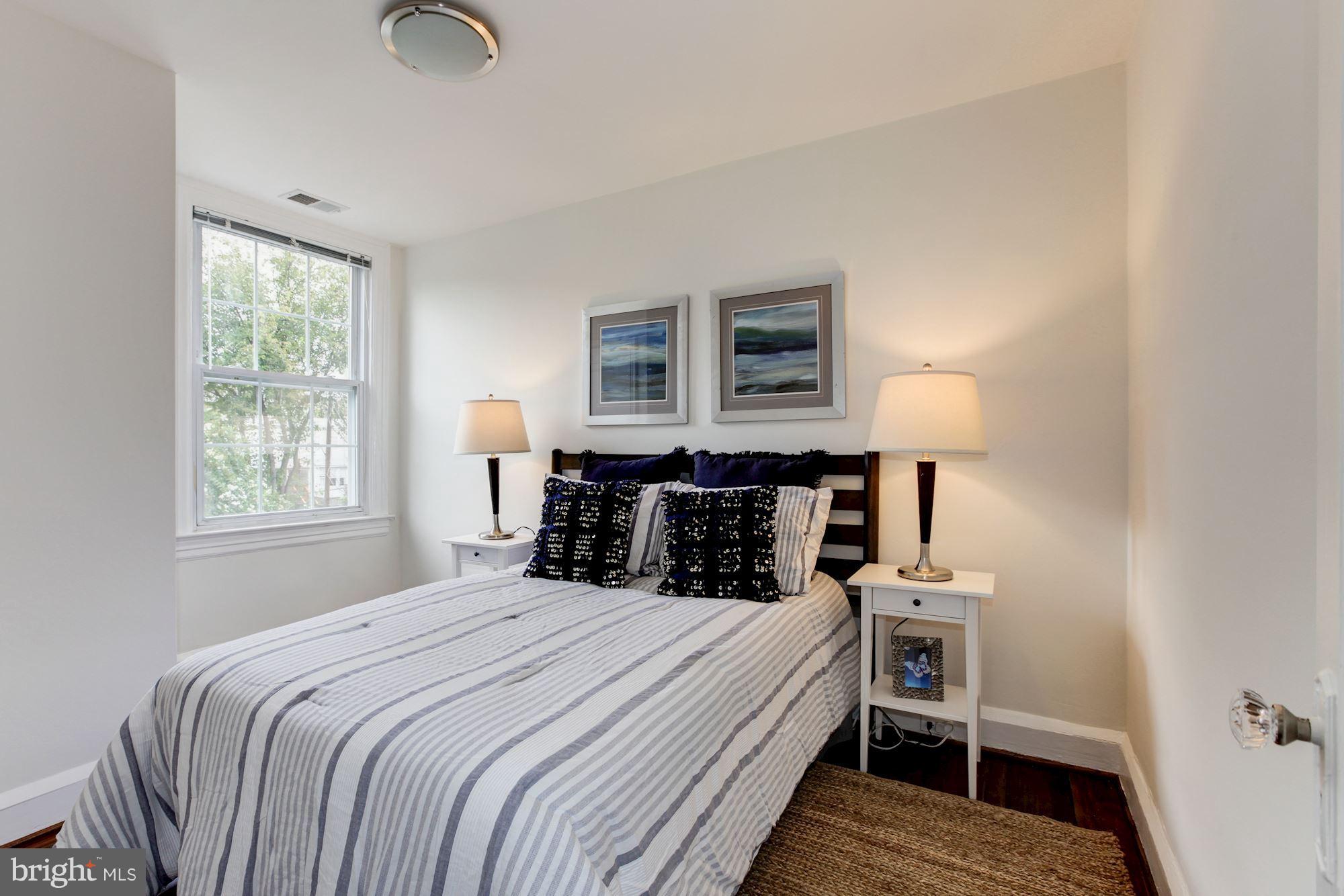 3523 S Street Northwest Washington, DC 20007 - Photo 7 of 15 a bedroom with a bed and a lamp