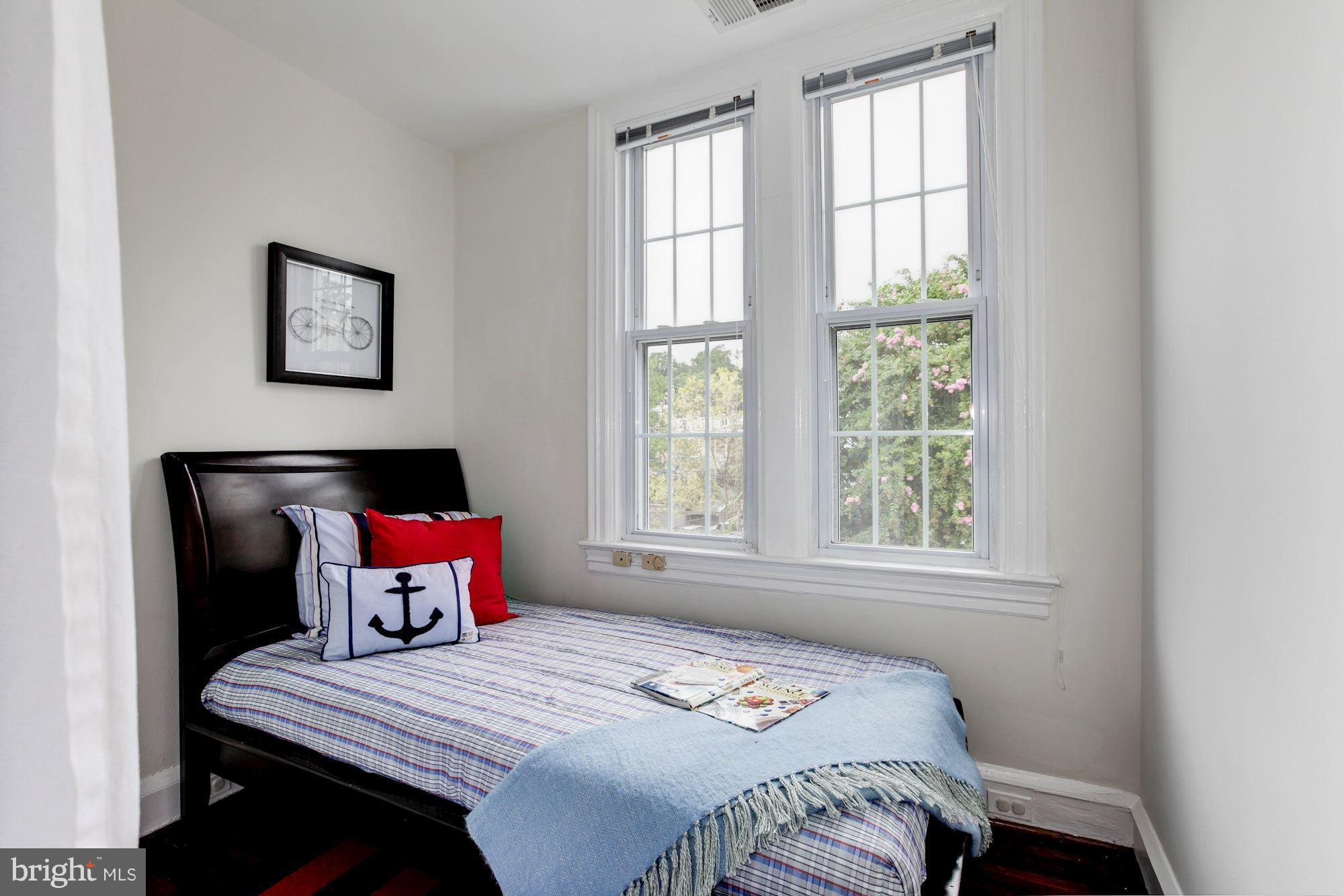 3523 S Street Northwest Washington, DC 20007 - Photo 8 of 15 a bedroom with a bed and window