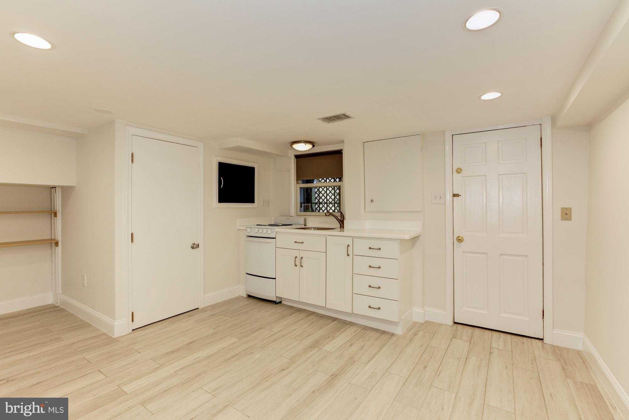 3523 S Street Northwest Washington, DC 20007 - Photo 10 of 15 a room with a dresser and a flat screen tv