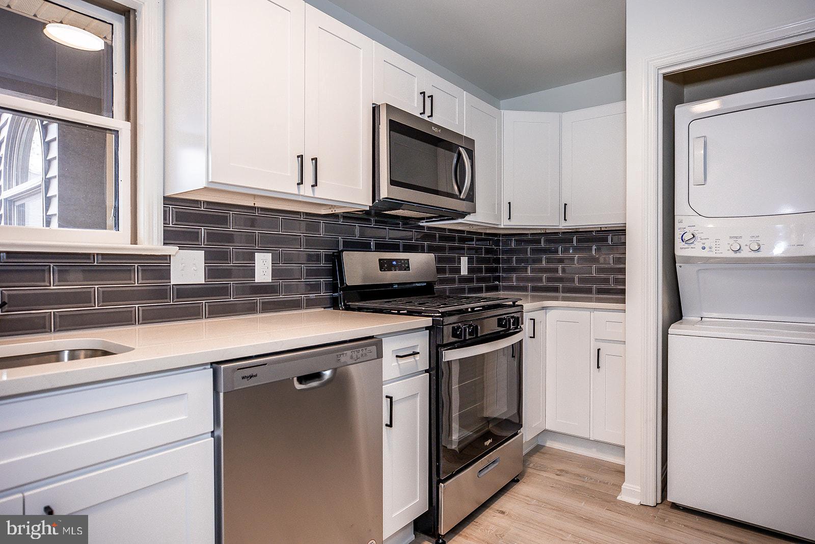 24 Amberly Way Lititz, PA 17543 - Photo 13 of 38 a kitchen with stainless steel appliances a stove microwave and a refrigerator