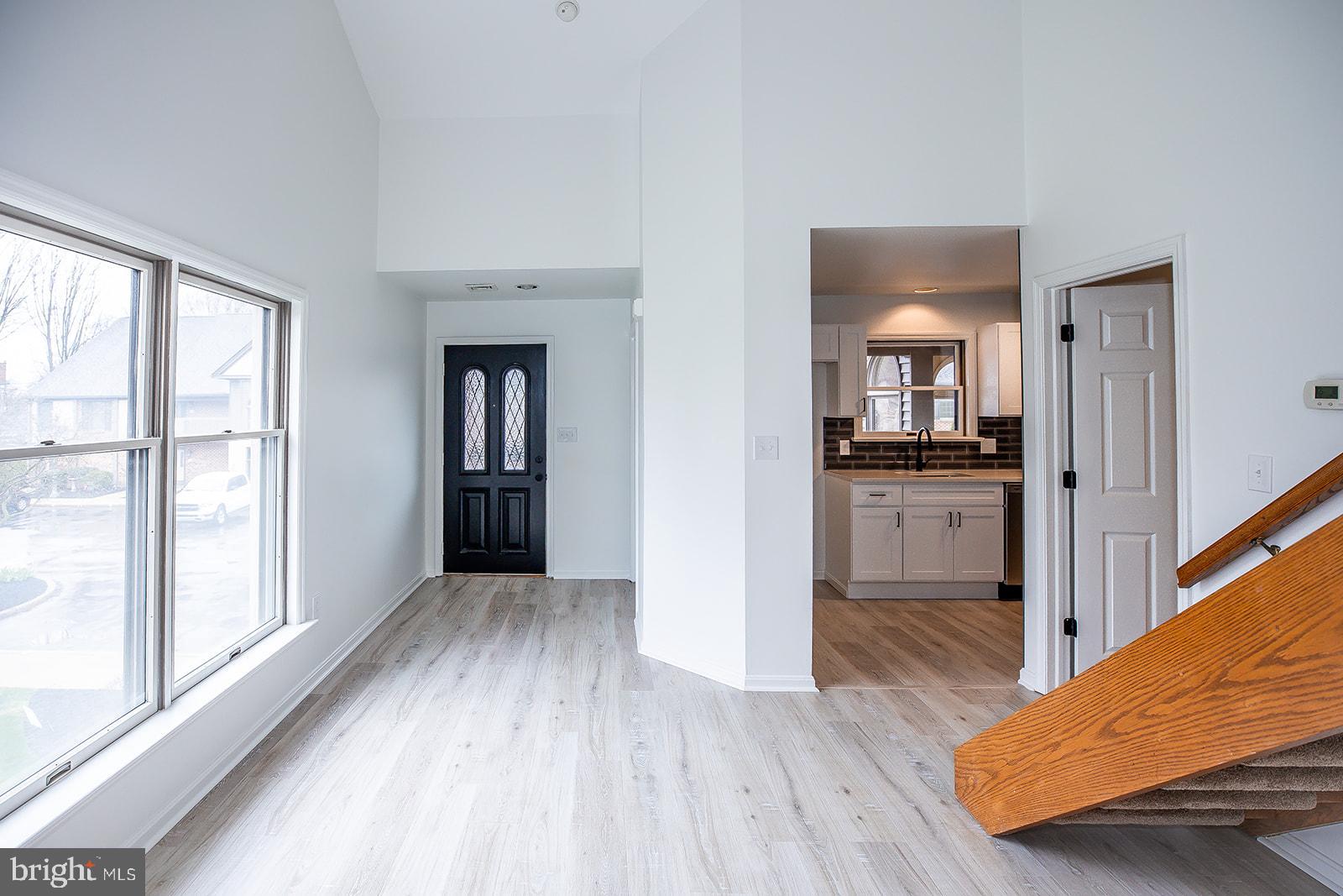 24 Amberly Way Lititz, PA 17543 - Photo 9 of 38 a view of a hallway with wooden floor and cabinets