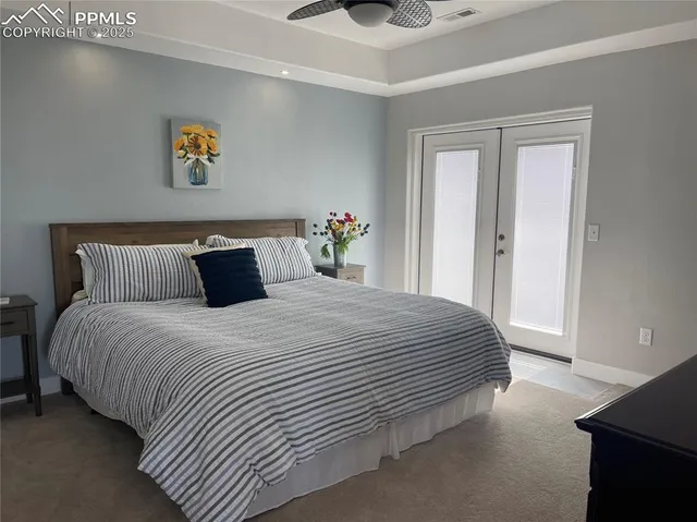 a bedroom with bed and window