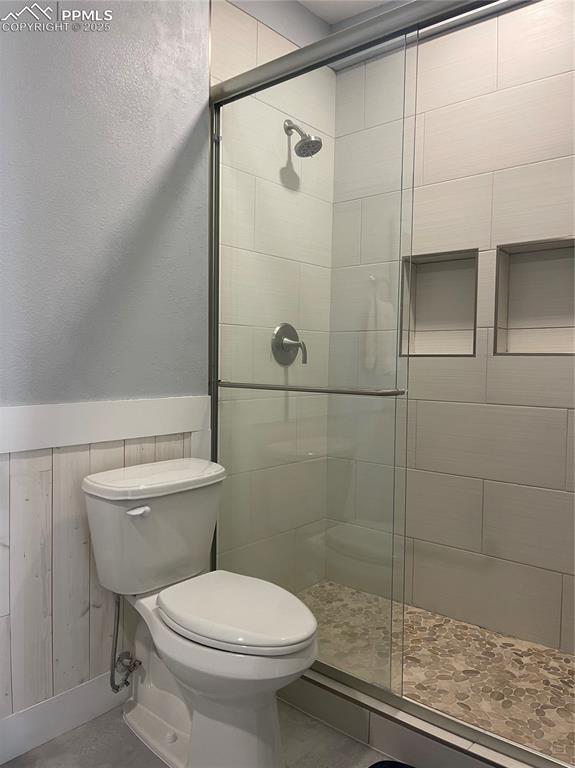 32215 Big Springs Road Yoder, CO 80864 - Photo 16 of 17 a bathroom with a toilet and a shower