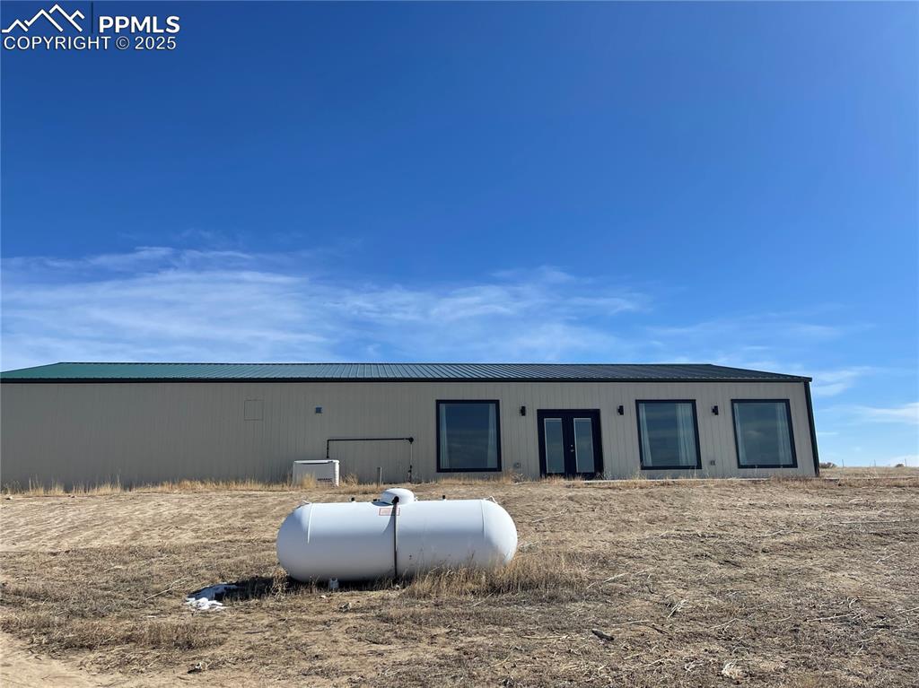 32215 Big Springs Road Yoder, CO 80864 - Photo 8 of 17 a front view of a house with cars