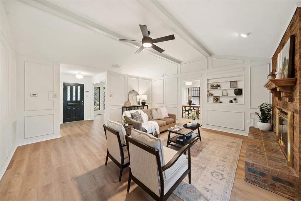 a view of a livingroom with furniture and a ceiling fan